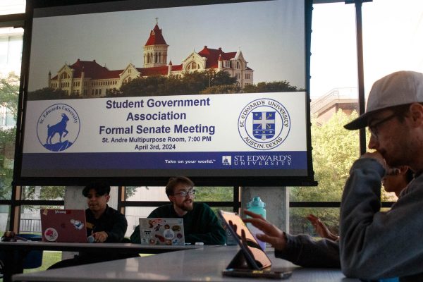 Senators wait for the senate meeting to begin. Catch a meeting in the Andre Multipurpose room on Thursdays at 7 p.m..