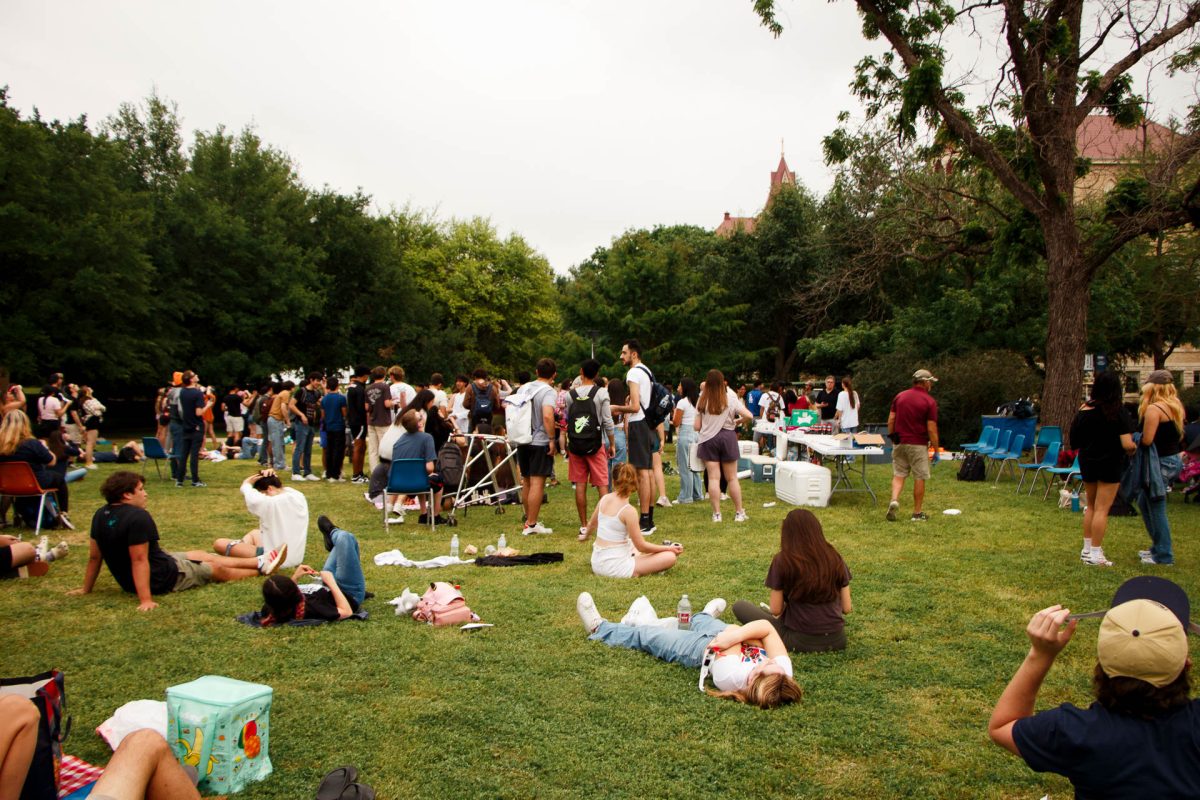 Attendees hanging out on the lawn, waiting for the total solar eclipse’s peak.