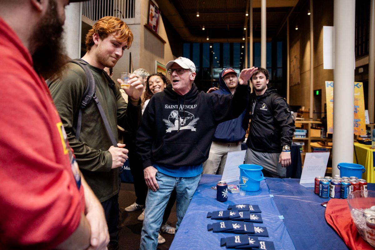 Students here are being taught a little more about Saint Arnold's Brewery by a sales representative. Students are seen here also having a super fun time! 