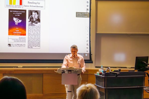 Jason Schneiderman reads from his collection. Despite the atmosphere of the event, he kept his own demeanor casual and fun, cracking jokes between poems and engaging the audience.