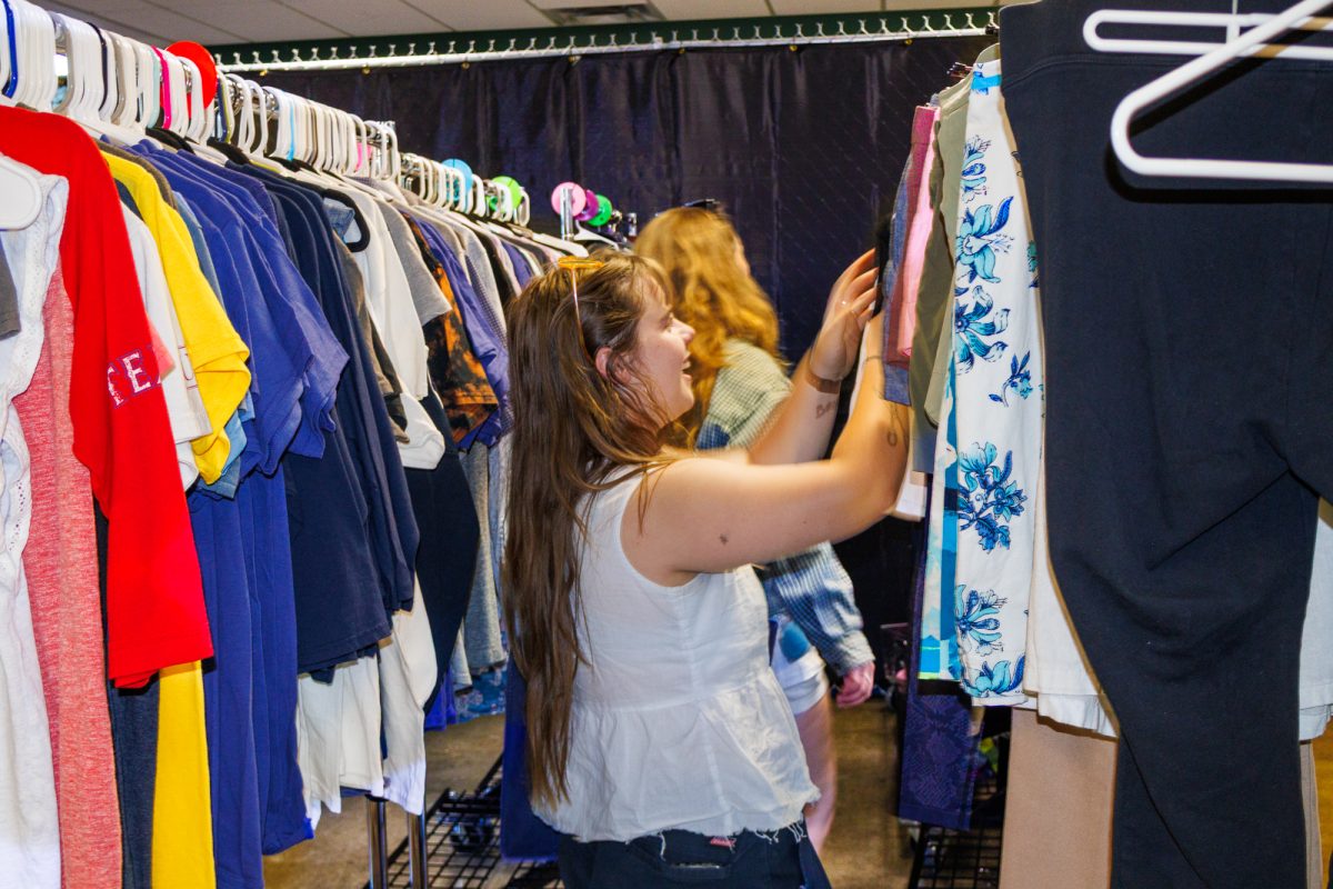 Students are able to look for clothes in the The Thrifty Topper. Sophomore political science major Ava Buxton is looking through the shirt rack. “I think that it is great because it’s really embarrassing to ask for free stuff,” Buxton said. “I think everybody’s kind of embarrassed to ask for free things, and so to go through any more hoops than just having to have your ID to get in is difficult.”