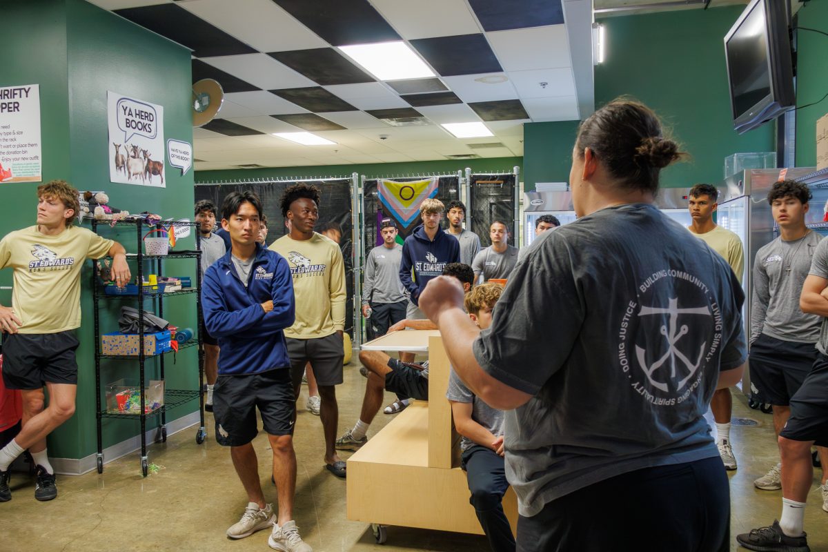 Before the shipment arrived, Manjarrez talked about The Huddle to the men’s soccer team, saying, “This space is for you.” She then divided them into groups to complete different tasks including cleaning the fridges, wiping things down and making space on the shelves. 