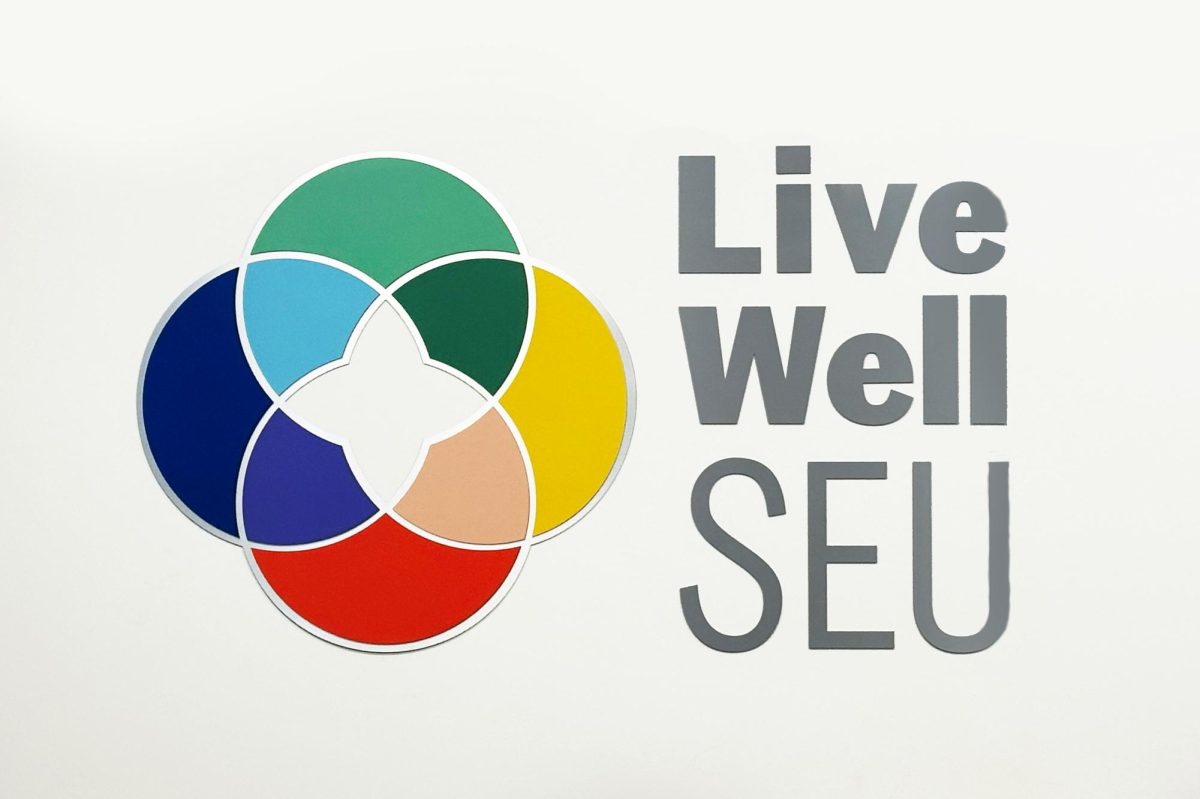 Located in the RAC, the “Live Well SEU” logo shows the university’s commitment to student wellness. “We’re not just talking performance—we’re talking pressure, perfectionism, and navigating failure,” Kuchar said. “This work supports both well-being and athletic success.”