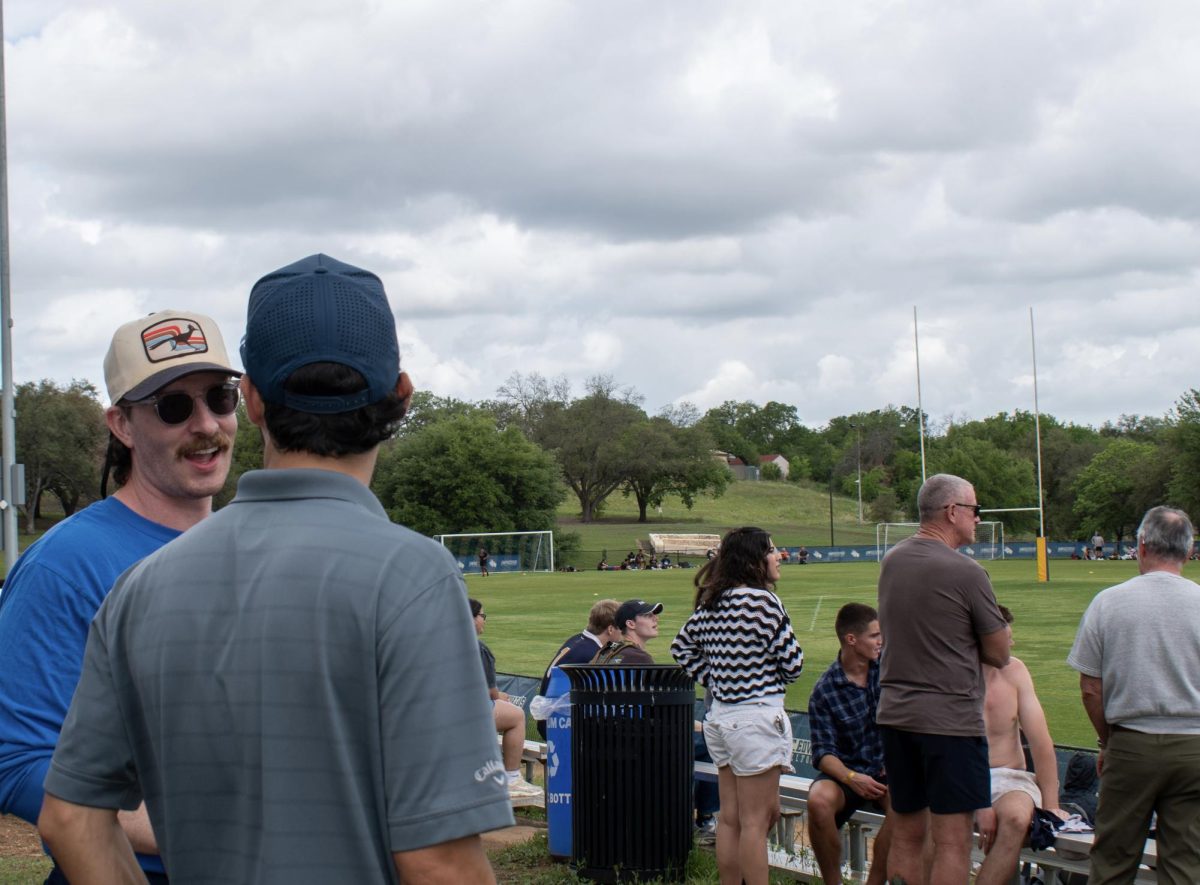 Friends and family gather around to watch the 7x7 rugby tournament. Rugby alumni reunite and reminisce on their time on the hilltop, enjoying the drinks and atmosphere.